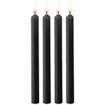 Vier schwarze SM Ouch-Kerzen für sinnliche Spiele