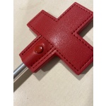 Red metal whip with leather cross